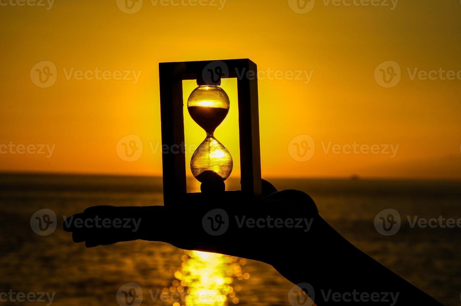 Hourglass and sunset photo