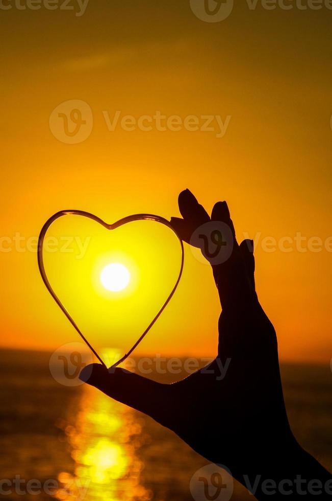 corazón y puesta de sol foto