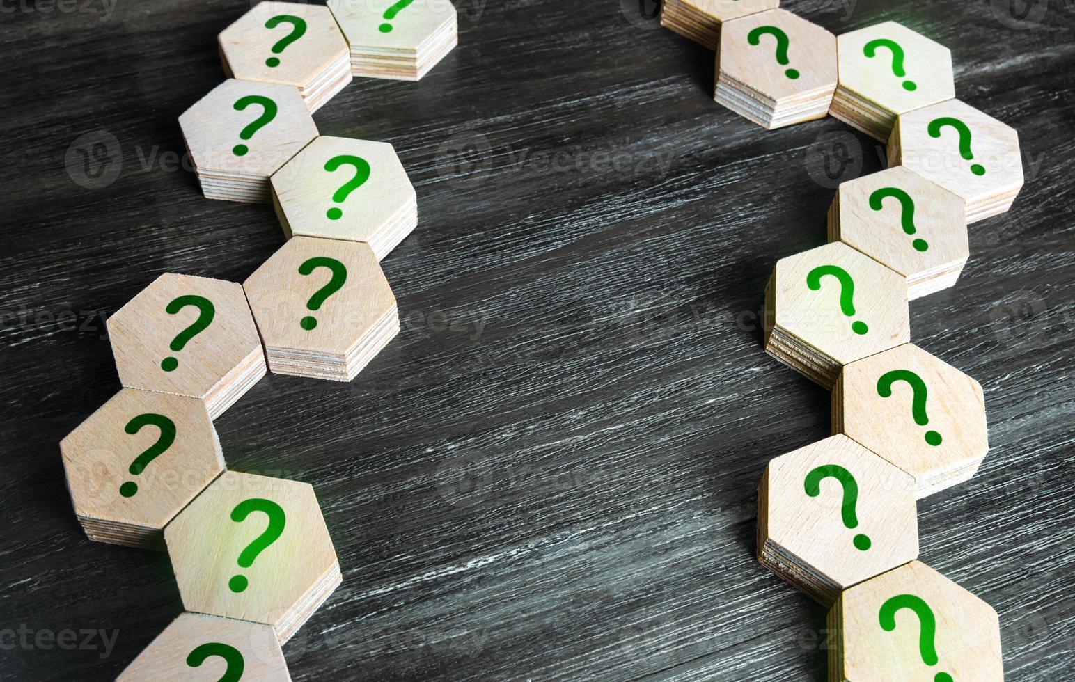 Chains of blocks with a question mark. Unknown facts. Curiosity, exploration. Questions and problem solving. Technologies and science. Development tree and logical chains of cause and effect. photo