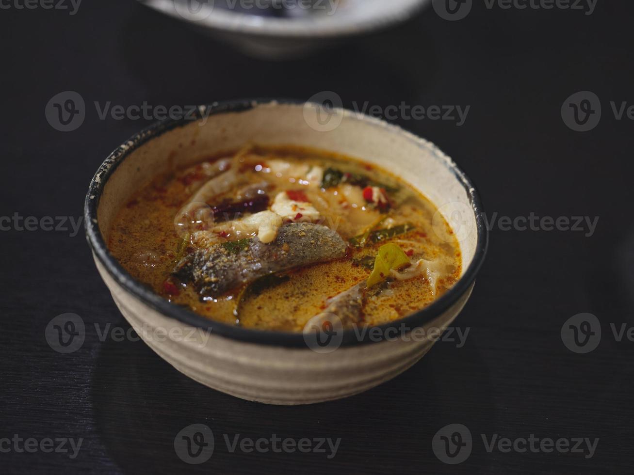 Thai soup , Tom Yum with fish , coconut milk photo