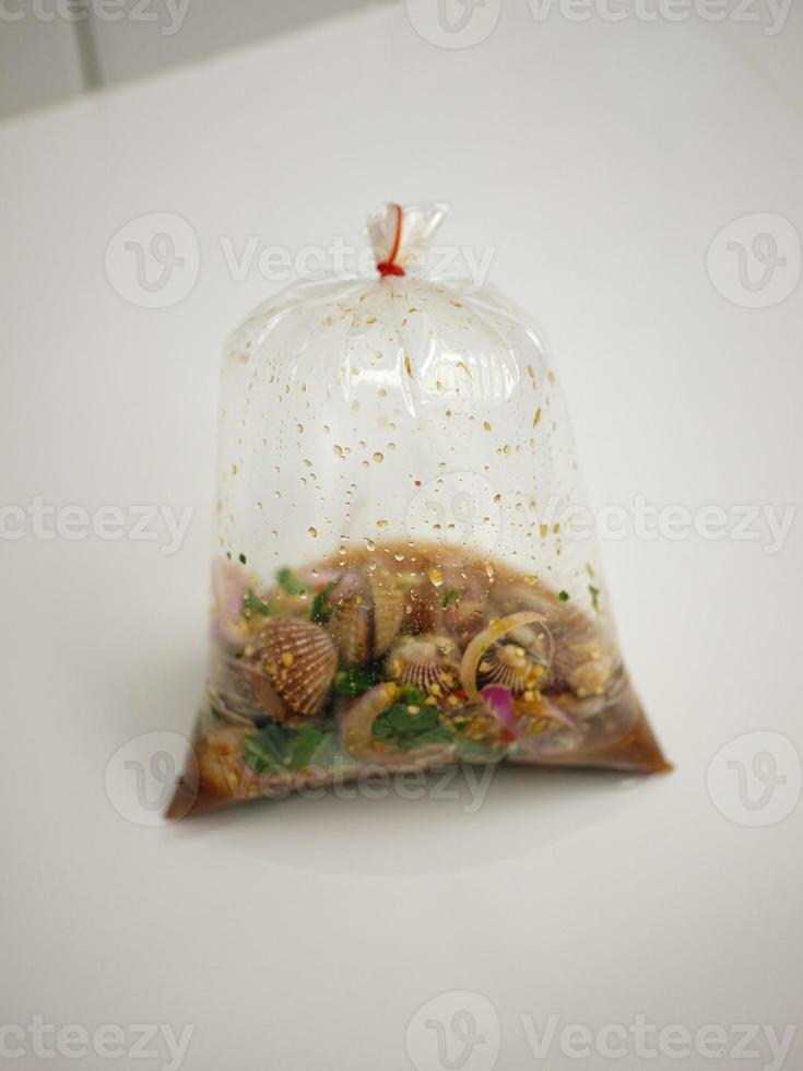 Thai street food , Spicy blood cockle salad in PACKAGE photo