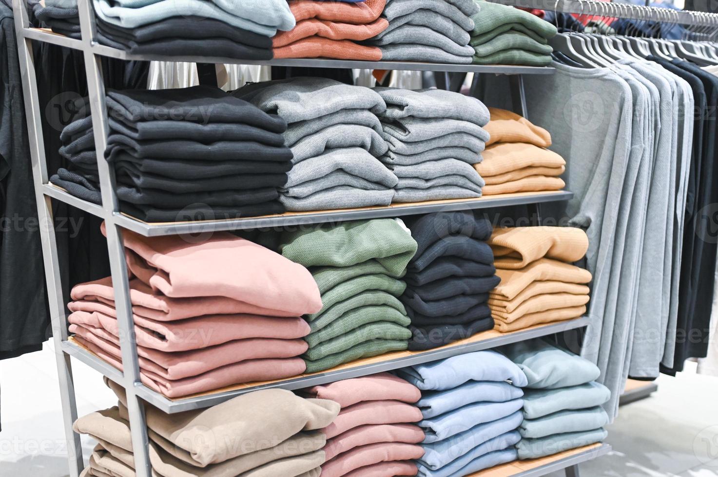 A set of colored sweaters in the store on sale photo