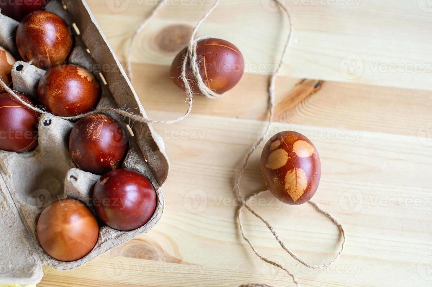 Painted eggs cooked for Easter are in an eco-friendly tray. drawings on easter eggs photo