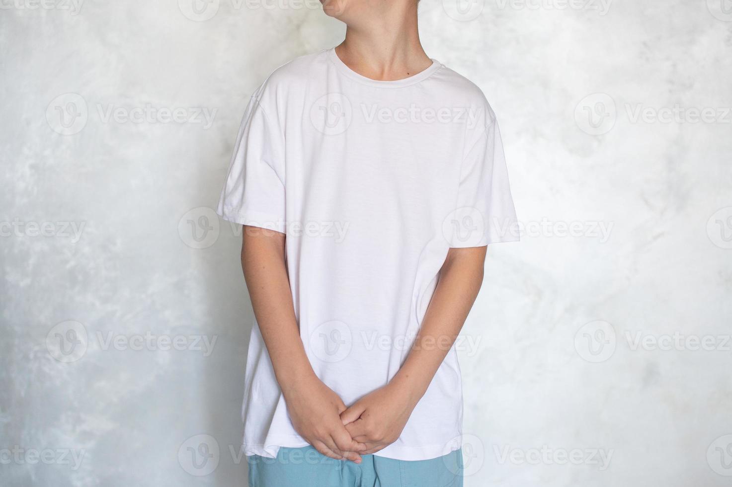 The child is wearing a white T-shirt. Place for advertising photo