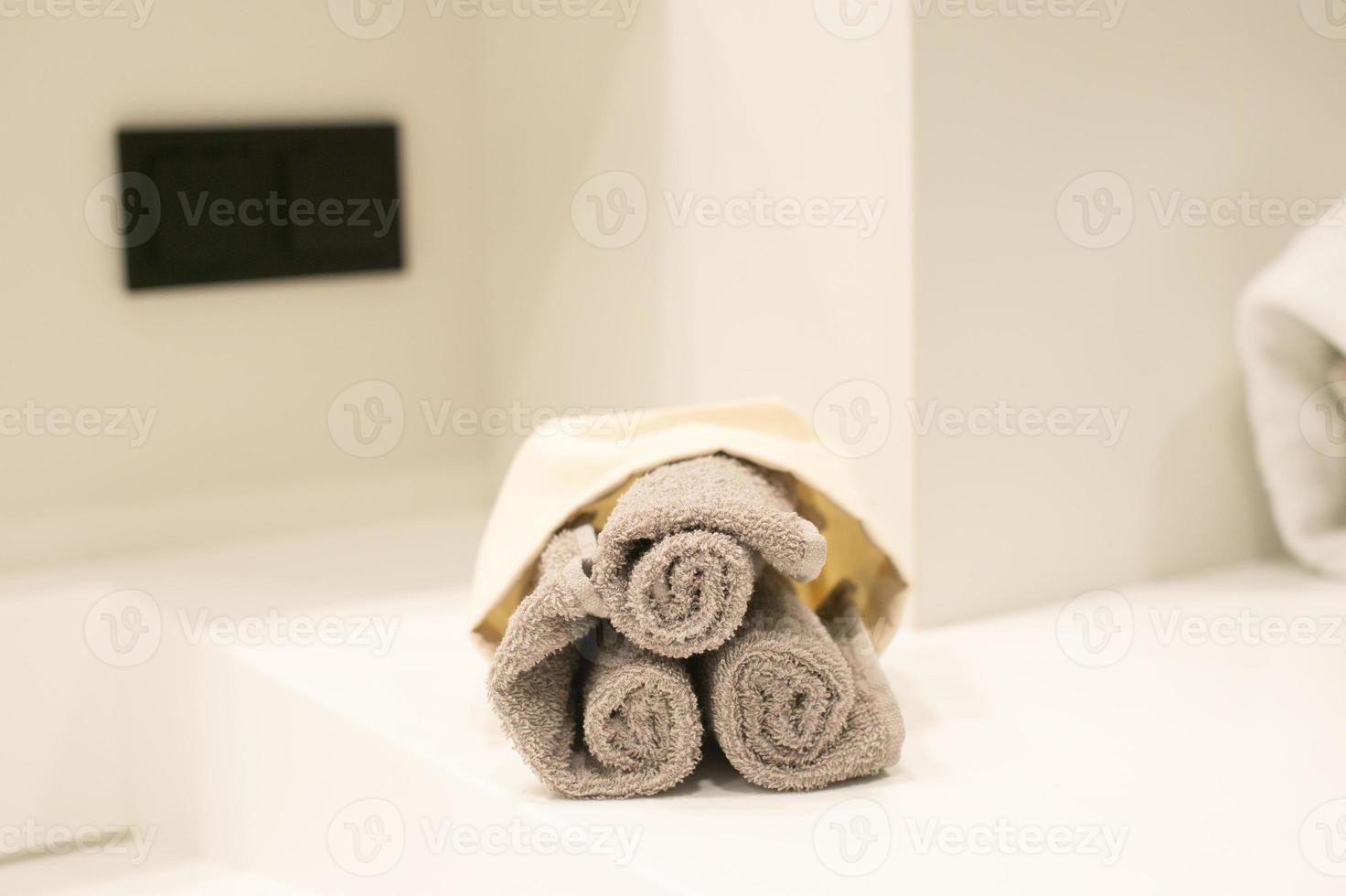 A set of terry towels are in the bathroom photo