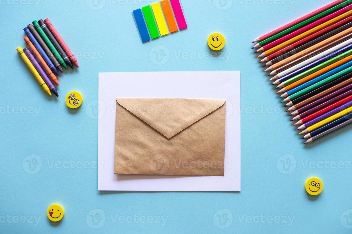 A set of bright stationery items on a blue background. Colour pencils photo