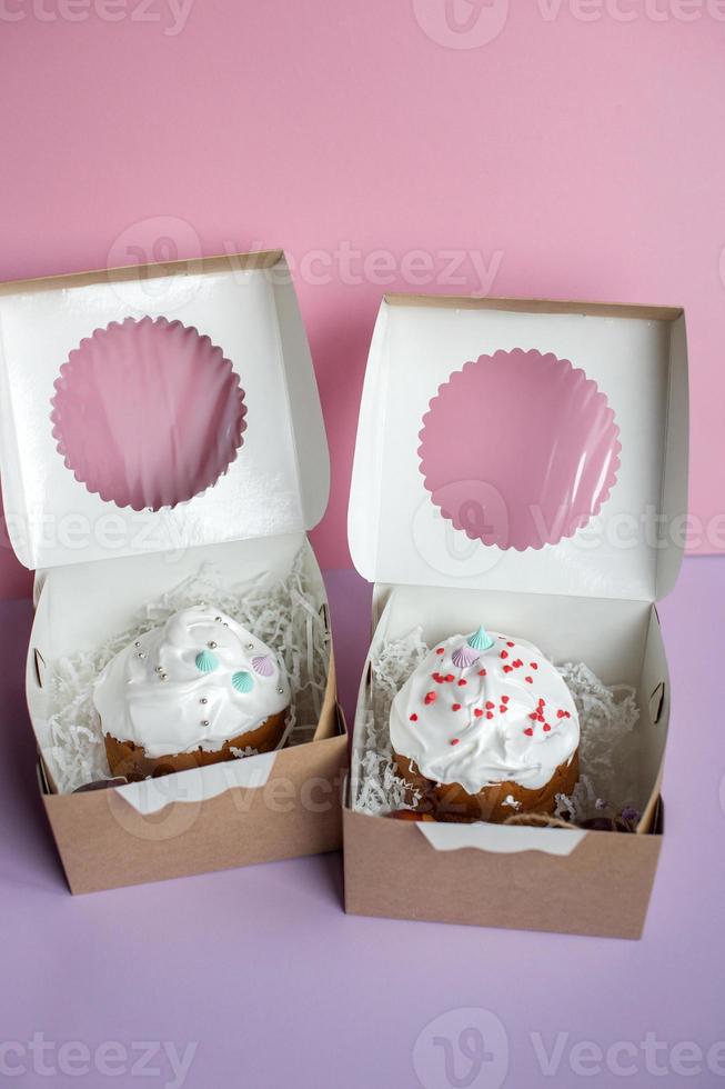 Easter cake kraffin in icing sugar is in a box with red eggs photo