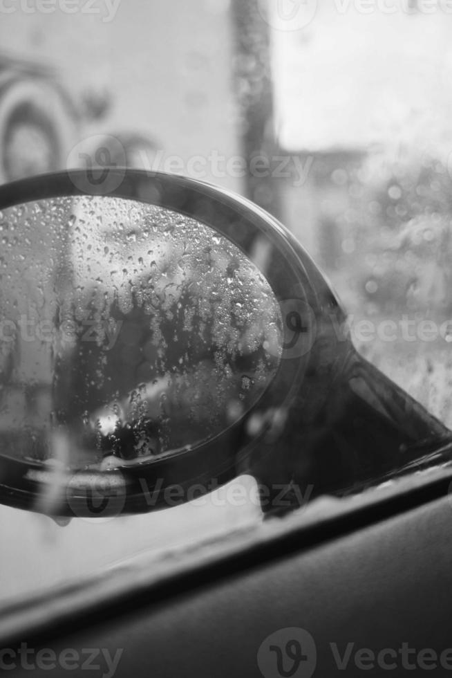 Hand wash with soap, pink foam on the body. Car washing with high pressure water. Wash Mini Cooper. photo