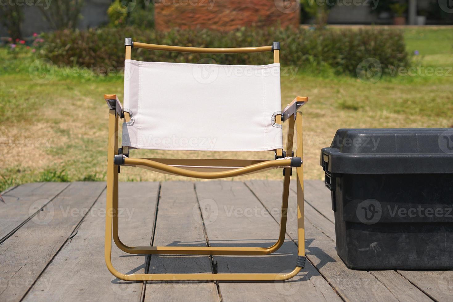 Camping chair on old wooden floor photo