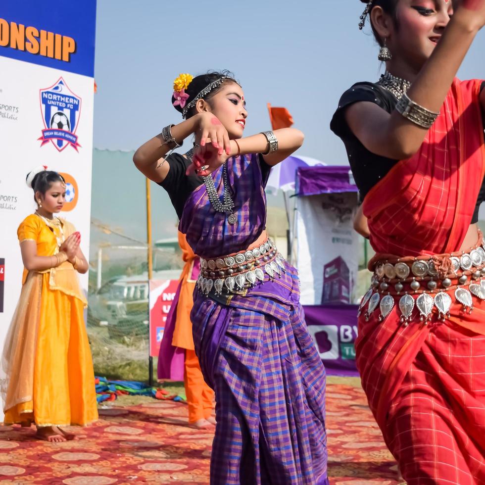 Delhi, India - December 11 2022 - Bharathanatyam Indian classical odissi dancers performing at stage. Beautiful Indian girl dancers in the posture of Indian dance. Indian classical dance Bharatanatyam photo