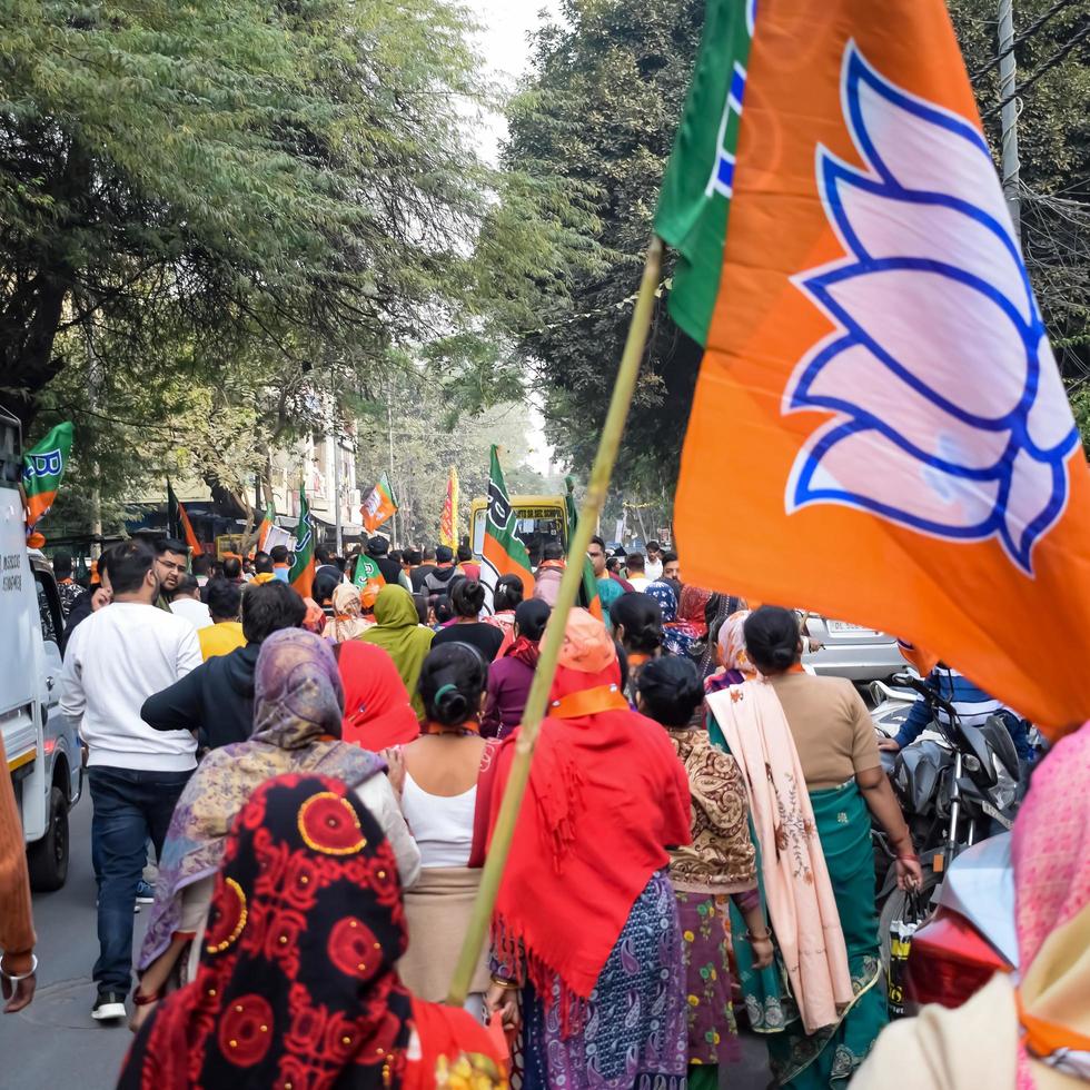 Delhi, India, December 02 2022 -Bharatiya Janata Party BJP supporter during mega road show in support of BJP candidate Pankaj Luthara to file nomination papers ahead of MCD local body Elections 2022 photo