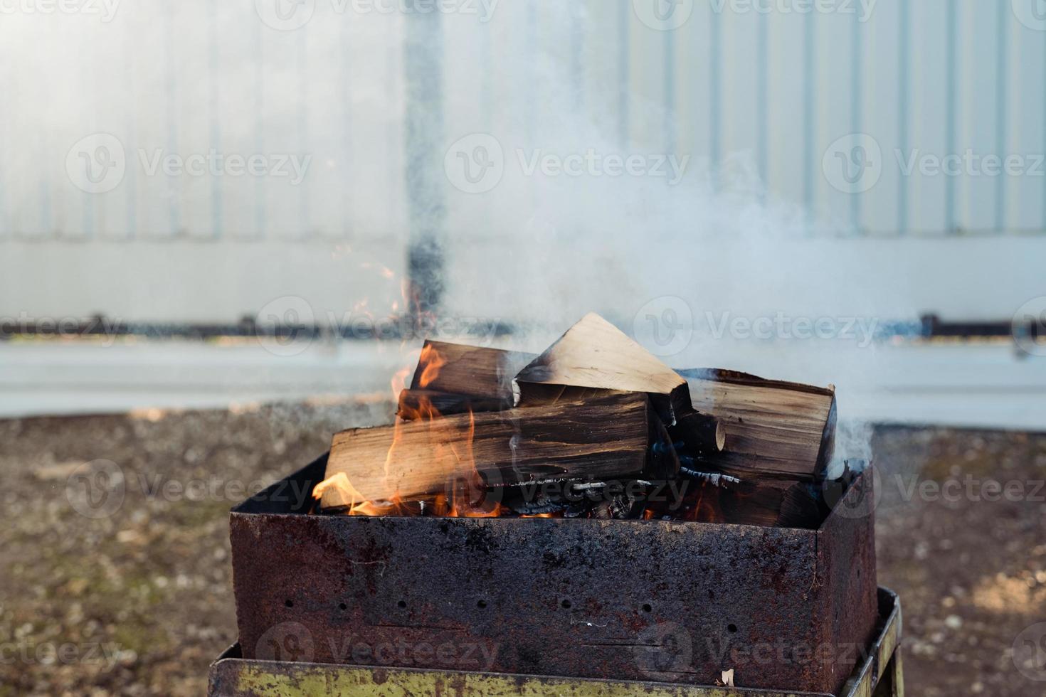 Prepare Grilling Charcoal Heat Flame For Roasting Meat.Sparking Fire In Grill On Cooking. Kindling Coals Flames In Mangal Barbecue photo