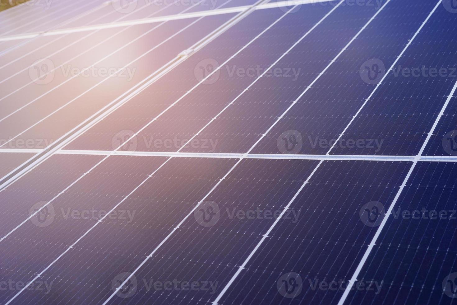 Close up of blue solar panel with Sunlight ray. Solar cell technology, Power cell alternative source of electricity. Photovoltaic cell panel. Clean energy power concept photo