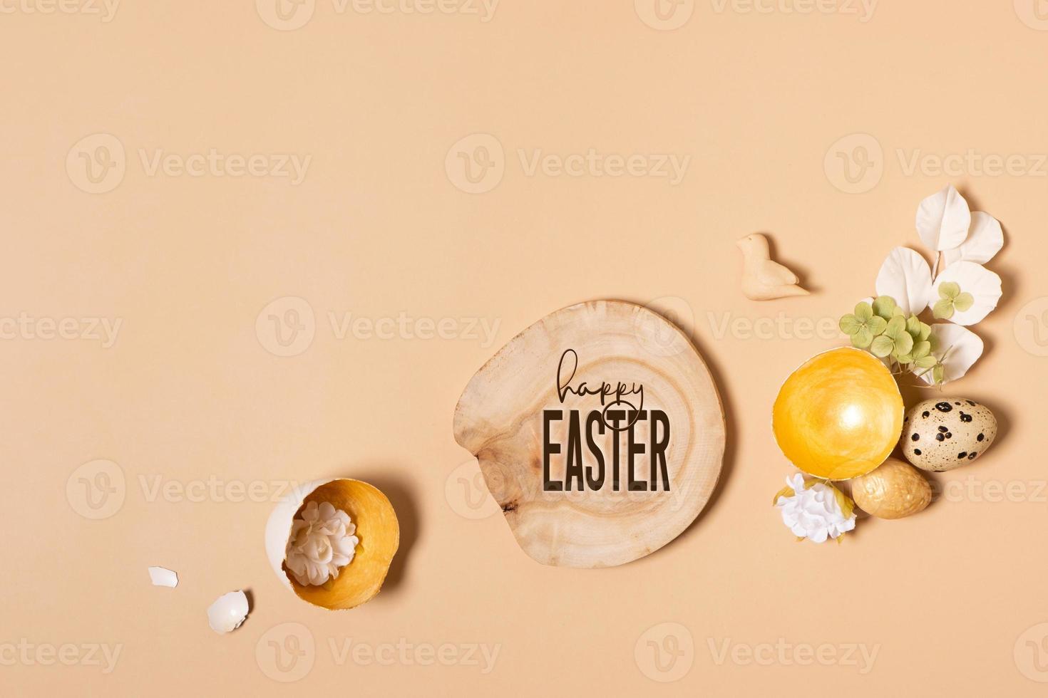Happy Easter text and eggs composition with flowers and twigs. Happy Easter greeting card photo
