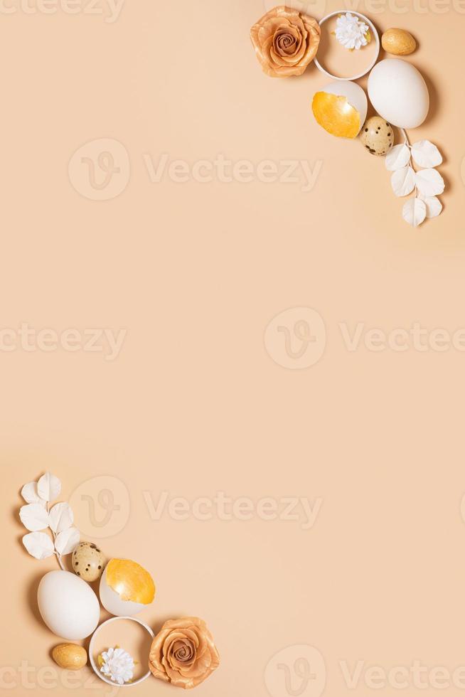 Monochrome flat lay Easter eggs composition decoration with twigs and flowers. Easter still life beige photo