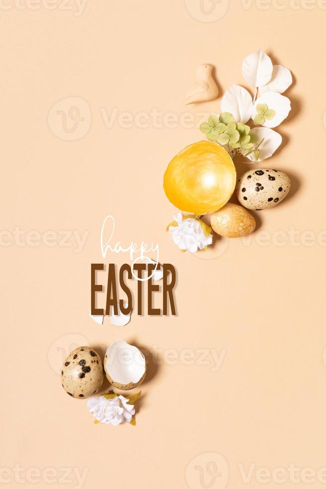 Happy Easter text and eggs composition with flowers and twigs. Happy Easter greeting card photo