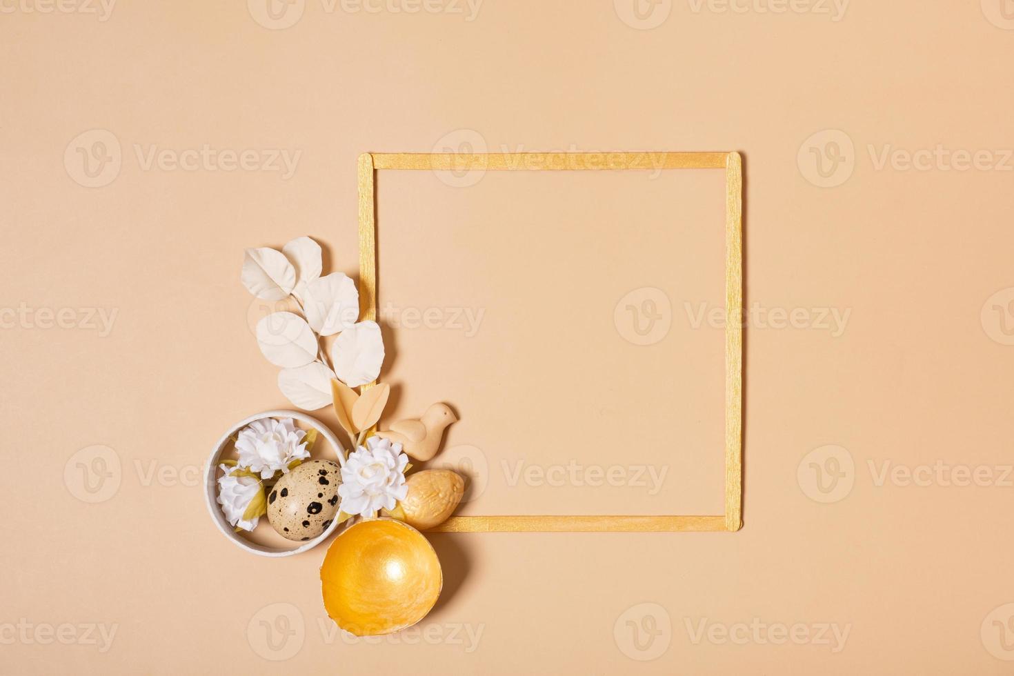 Frame with copy space and Easter eggs composition decorated with twigs and flowers. Easter flat lay monochrome photo