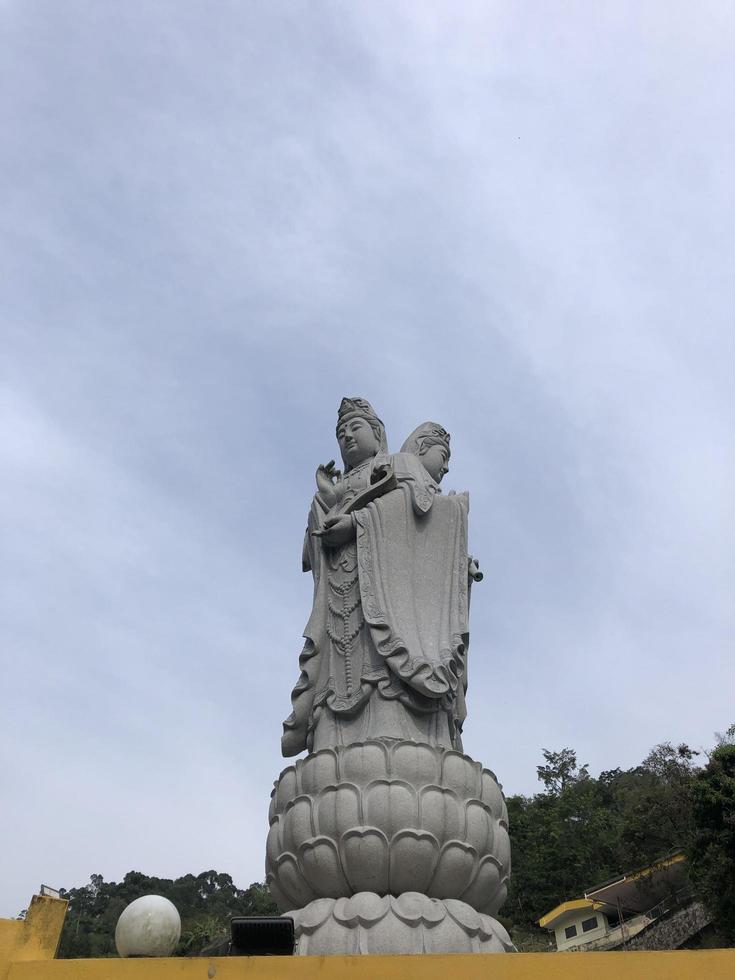 Solemn Buddha statue in Penang, Malaysia photo