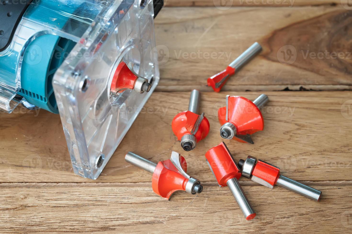 Router Bit and Trimmer router for Wood on wooden background, DIY maker and woodworking power tools concept. selective focus photo