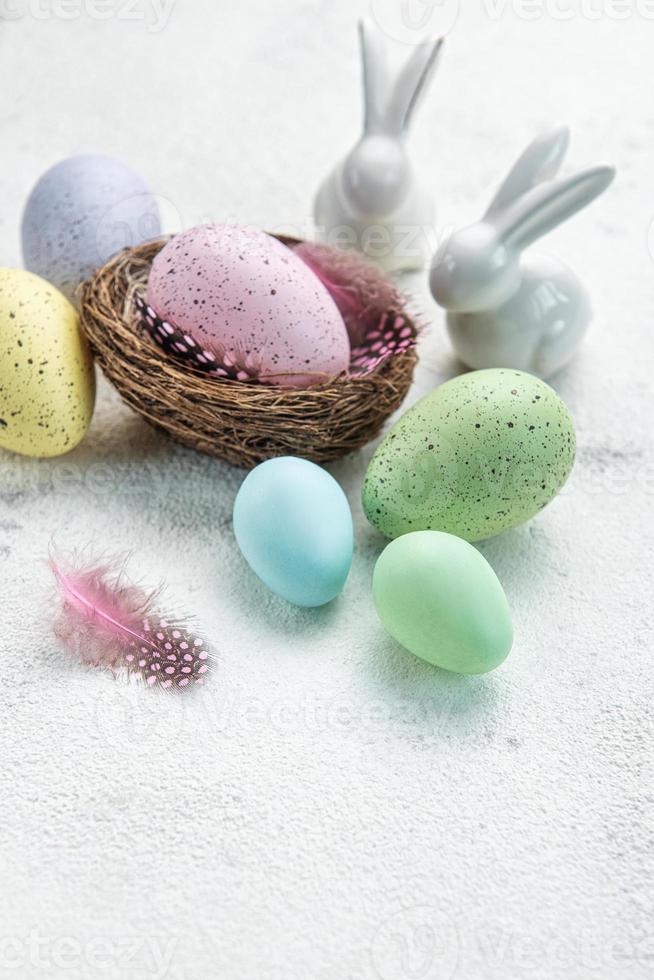 Easter background. Easter eggs in nest with decor. photo