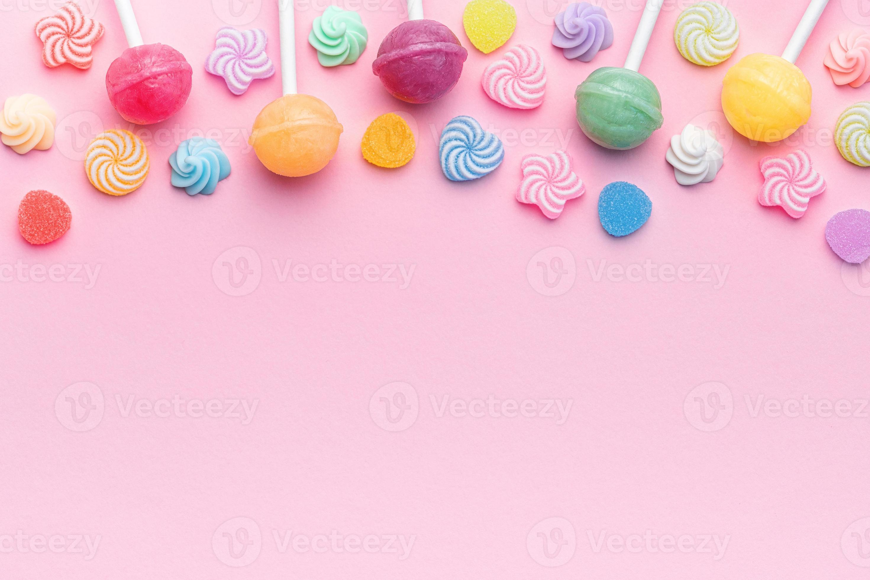 Sweet lollipops and candies on pink background 20798991 Stock Photo at
