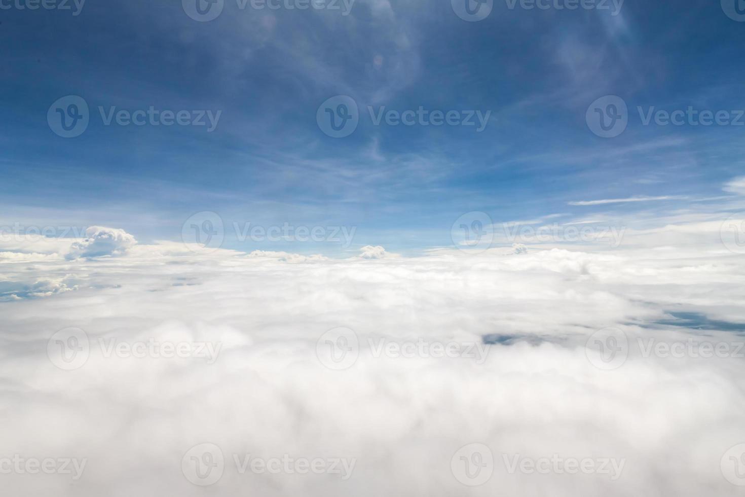 Sky and clouds view from inside the plane photo