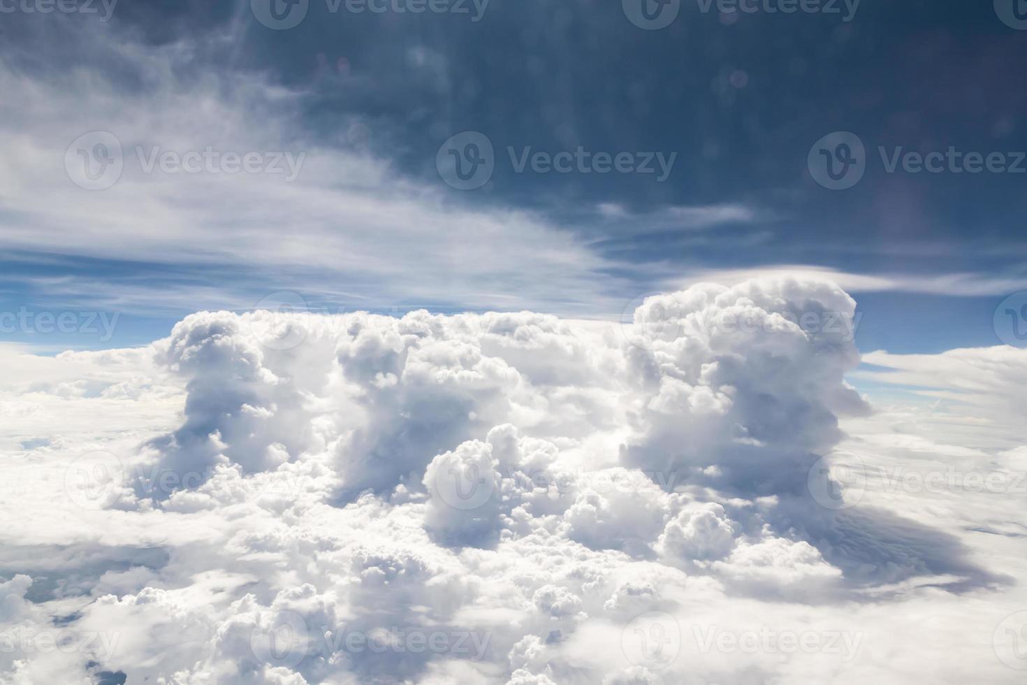 Sky and clouds view from inside the plane photo