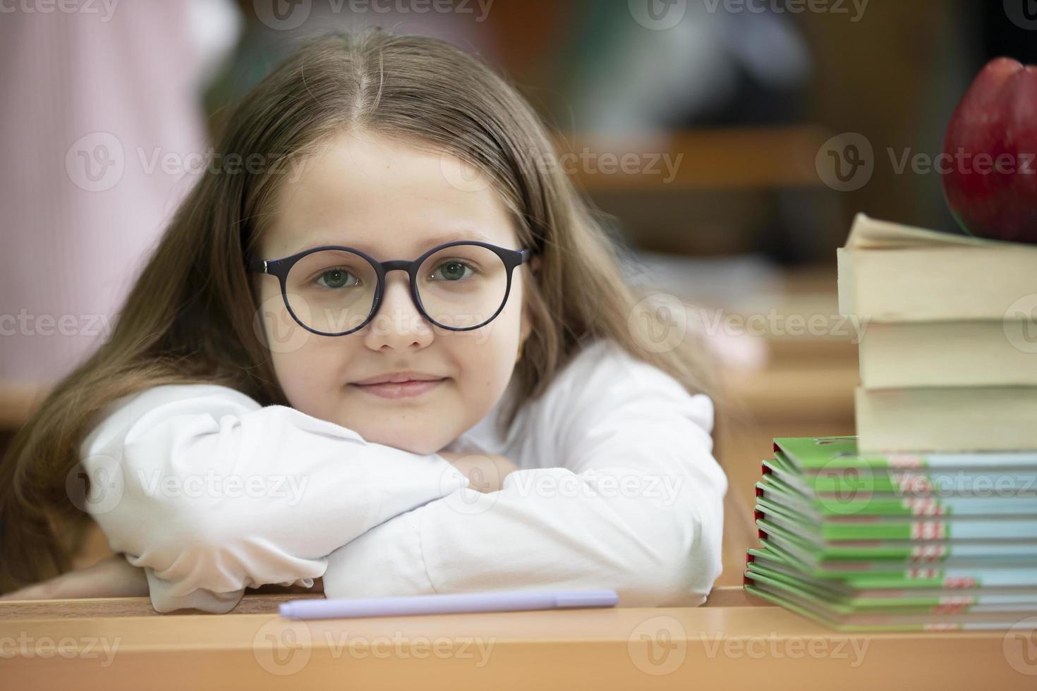 Portrait of a middle-aged schoolgirl with glasses. photo