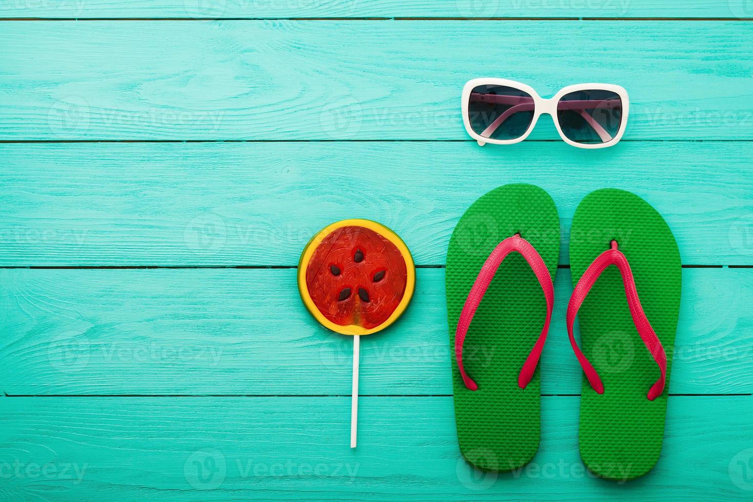 Flip flops. Beach holidays. Summer accessories and copy space on blue wooden background. Top view. Mock up. Copy space photo