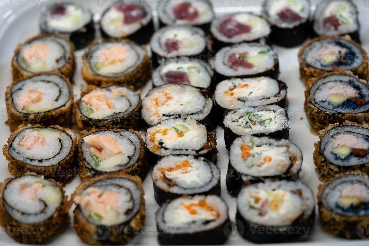 different Kinds of asia seafood sushi on a slate photo