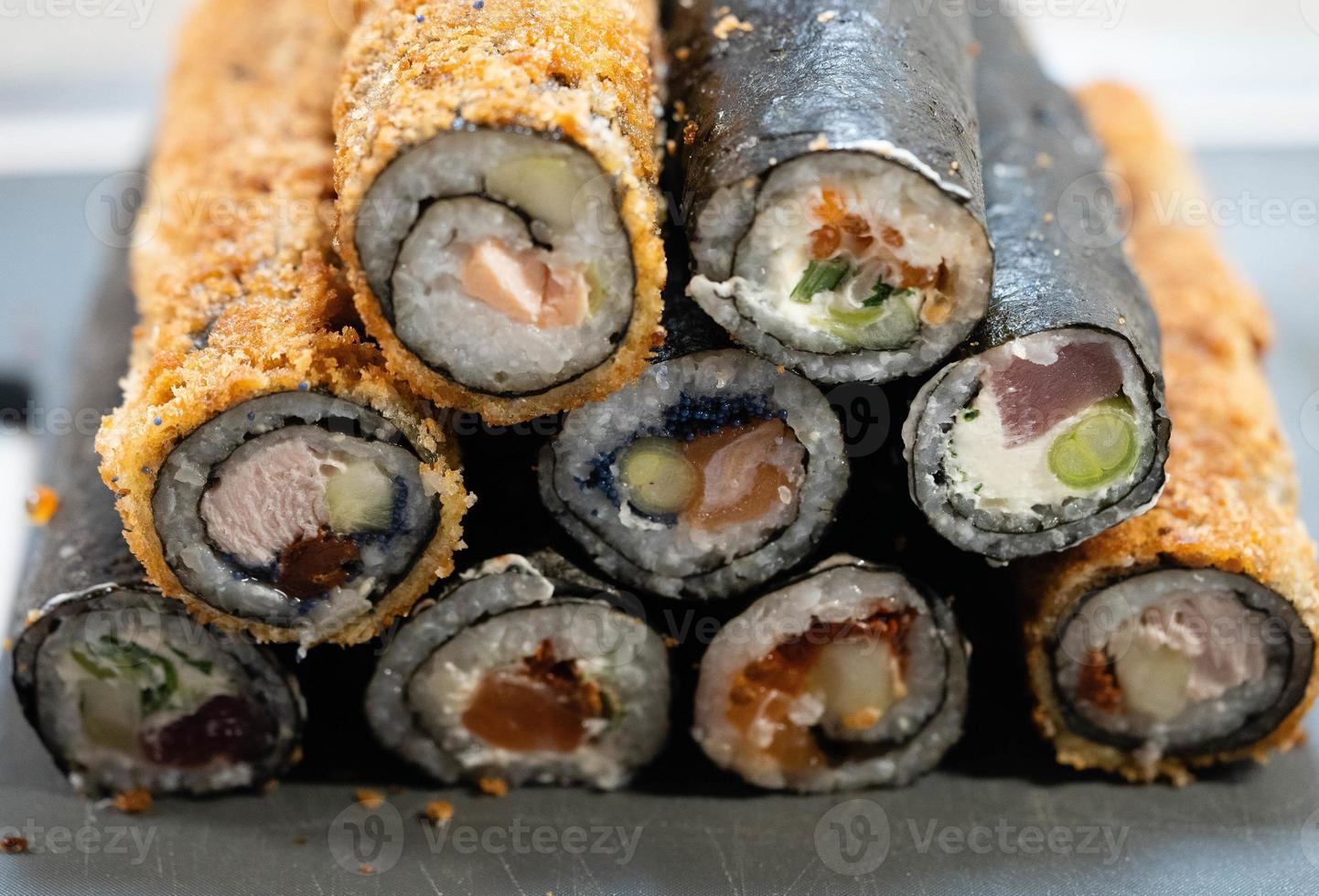 different Kinds of asia seafood sushi on a slate photo