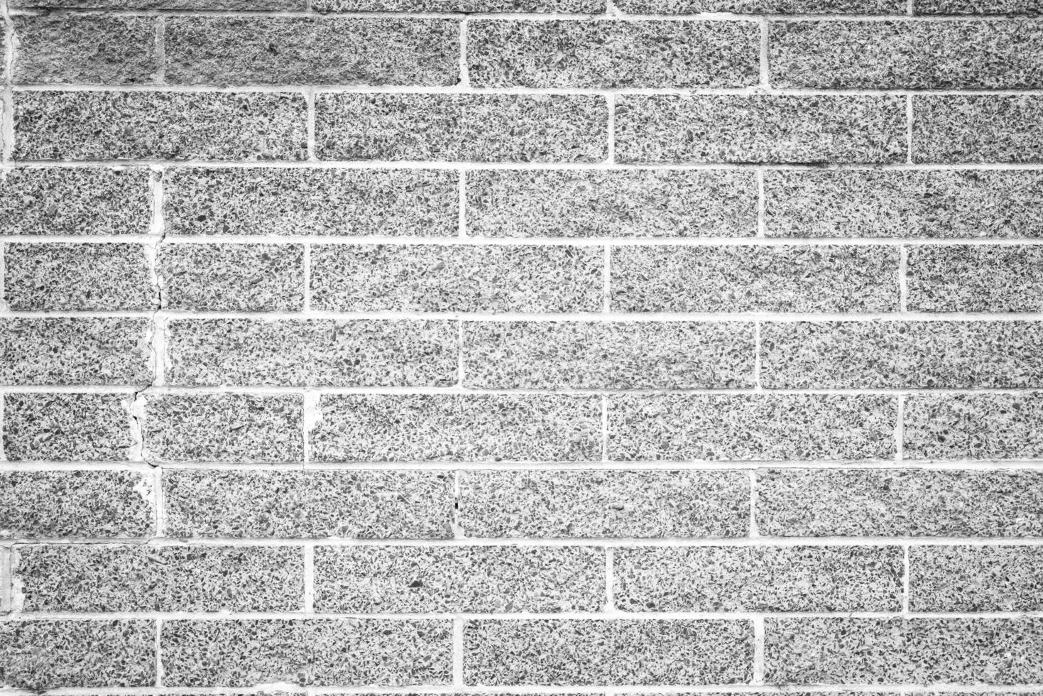 Full frame shot of white concrete wall textured and background. A concrete wall is a wall constructed of concrete blocks of uniform size. photo