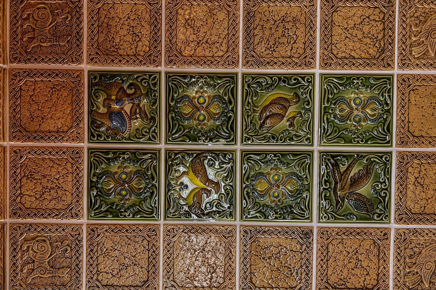 Close-up of a smooth floor visible from above in red and yellow. Tile squares. photo