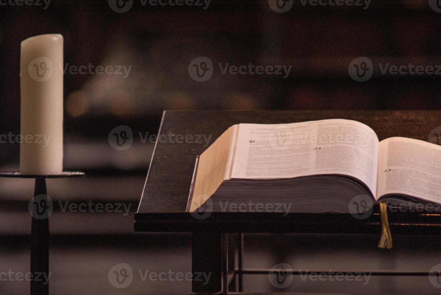 book and candles at the altar photo