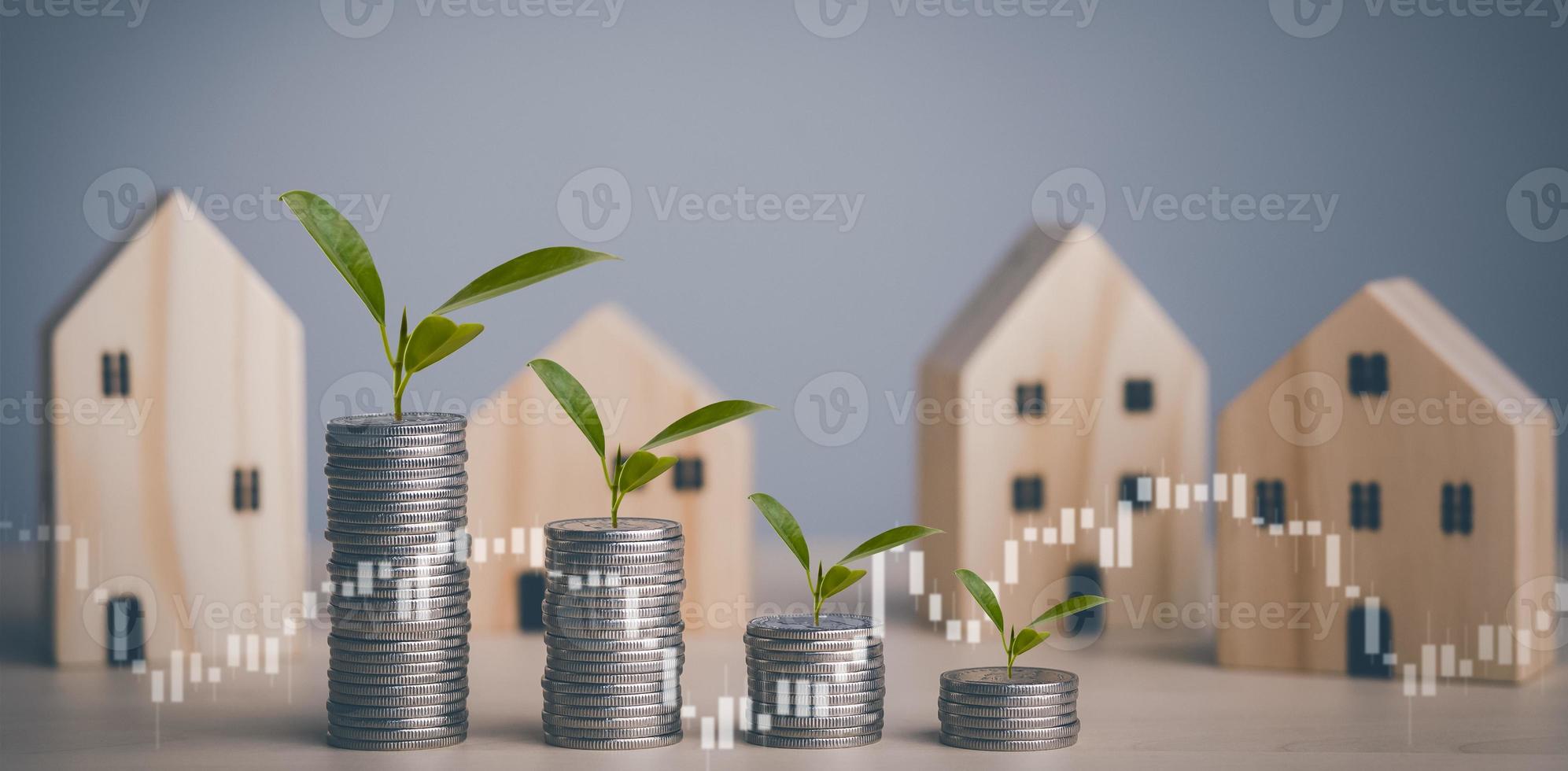 Concept Home with Coins stack and  leaf with line graph business on home background, Saving  ideas and  investment budget, Business saving money concept,Save money and budget business. photo