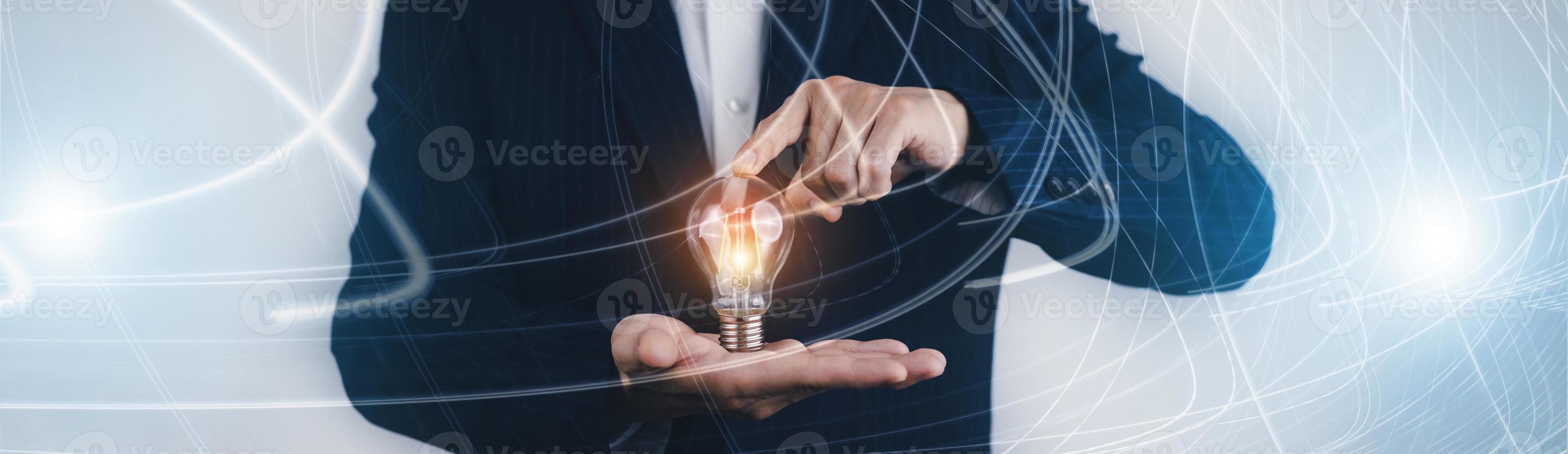 Innovative technology in science and communication concepts, and Creativity with glowing light bulbs.Hand hold light bulb with new idea concept with innovation, the new idea with energy and power photo
