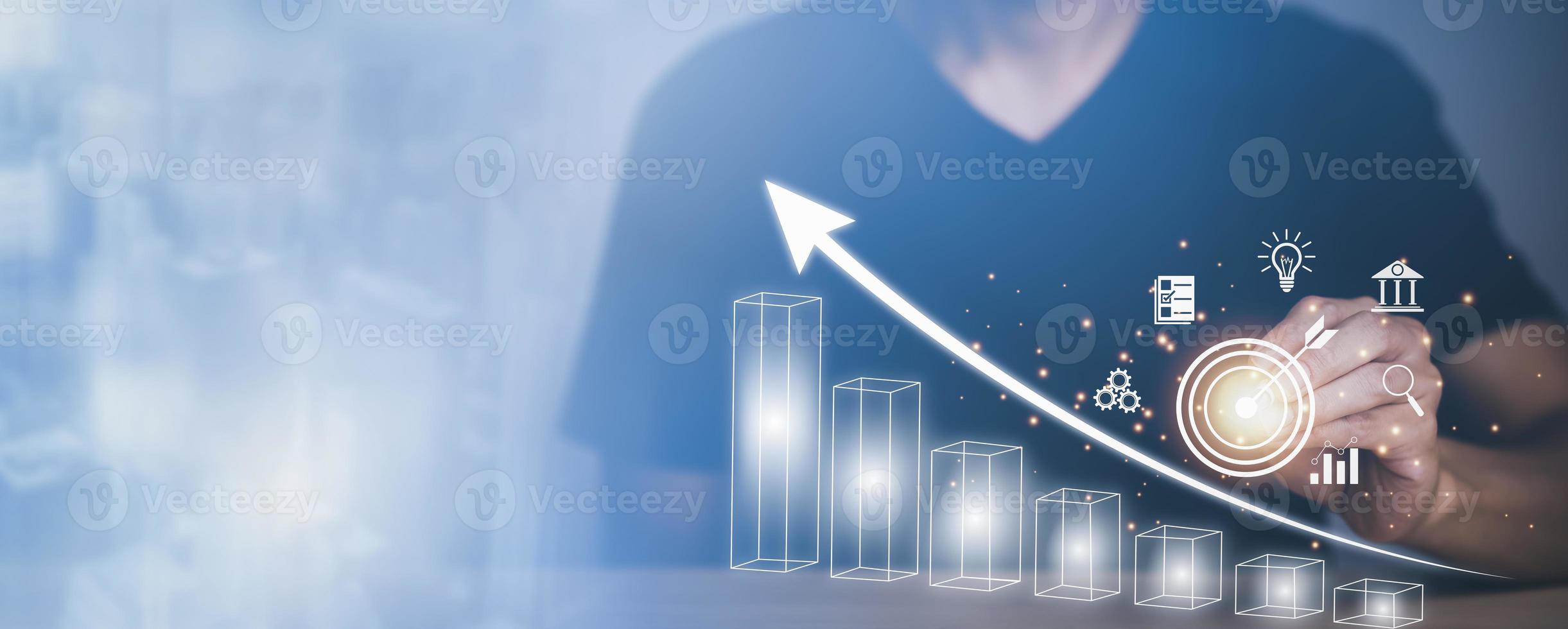 Man using pan touch target and analytics and financial concept, Plans to increase business growth and an increase ,Technology and Business trend analysis concepts, with business graphs, Tax concept. photo