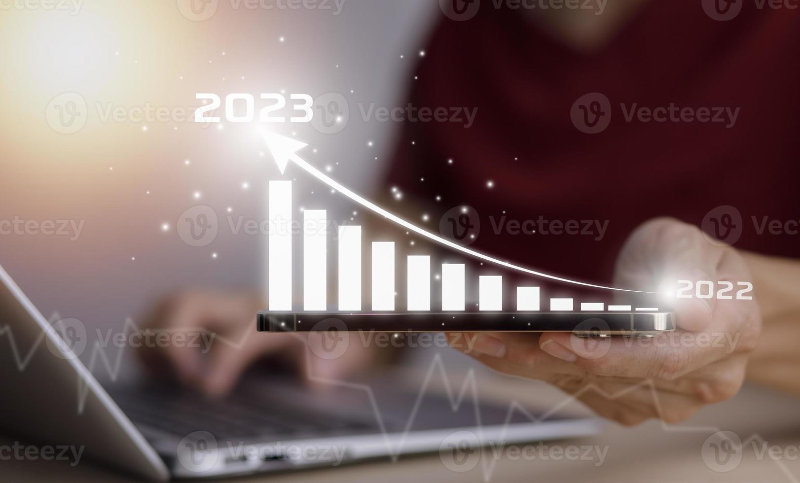 2023 and Startup concept with icon business and network connection on modern virtual interface from digital tablet.Businessman Touching tablet and graph Screen Icon of media screen, Technology Process photo