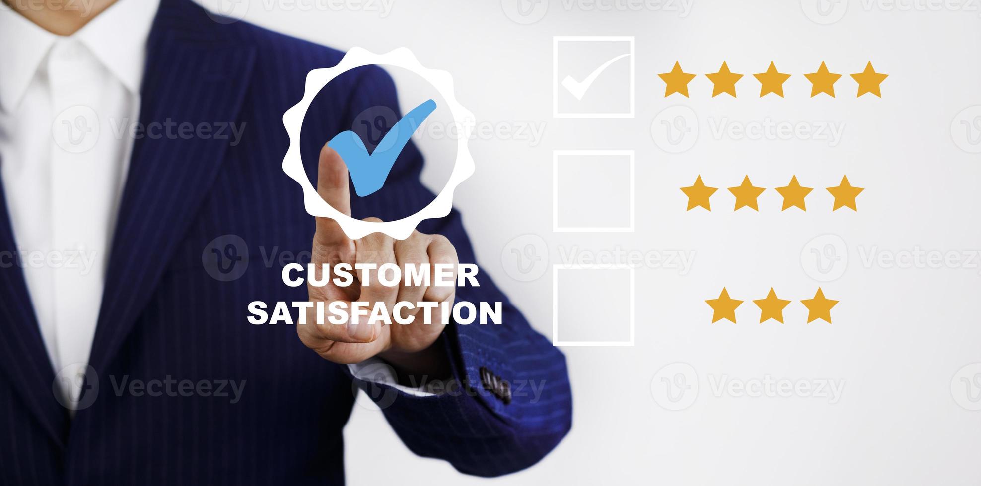 Businessman touch with Customer review satisfaction feedback survey concept, User give rating to service experience on online application, service leading to reputation ranking of business. photo