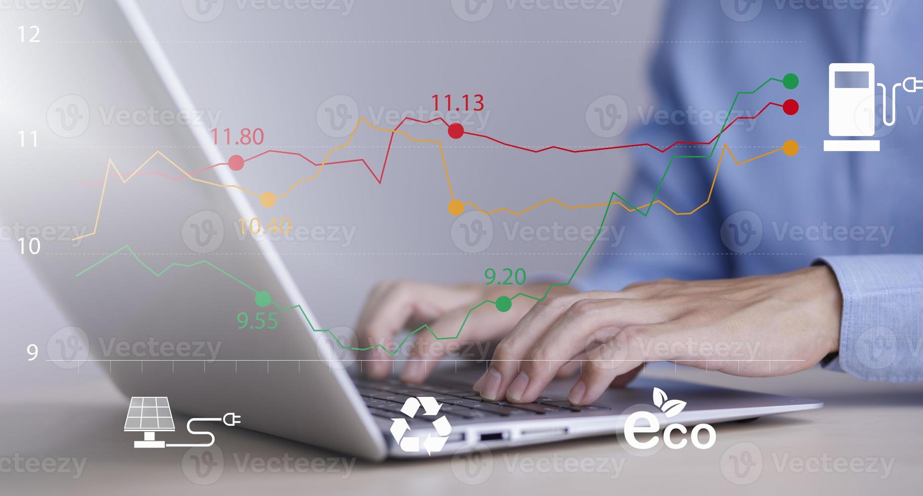 Man using laptop with Oil energy graph of the world market, impact on the economy concept,Businessman touch chart with the indicator on the oil price slide at gas station, fluctuations in oil prices. photo