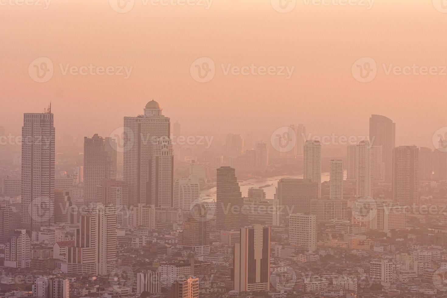 Bad air pollution in City. PM 2.5 dust in Bangkok or center city, Capital city are covered by heavy smog, Misty morning and sunrise in downtown with bad air pollution, Place to risk of cancer,Thailand photo