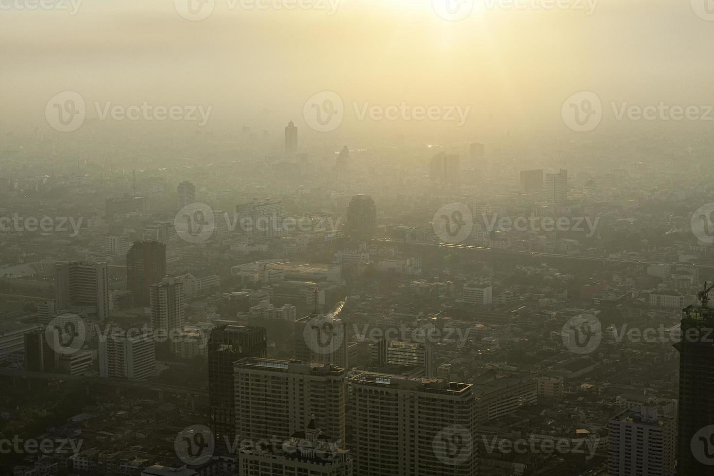 Bad air pollution in City. PM 2.5 dust in Bangkok or center city, Capital city are covered by heavy smog, Misty morning and sunrise in downtown with bad air pollution, Place to risk of cancer,Thailand photo