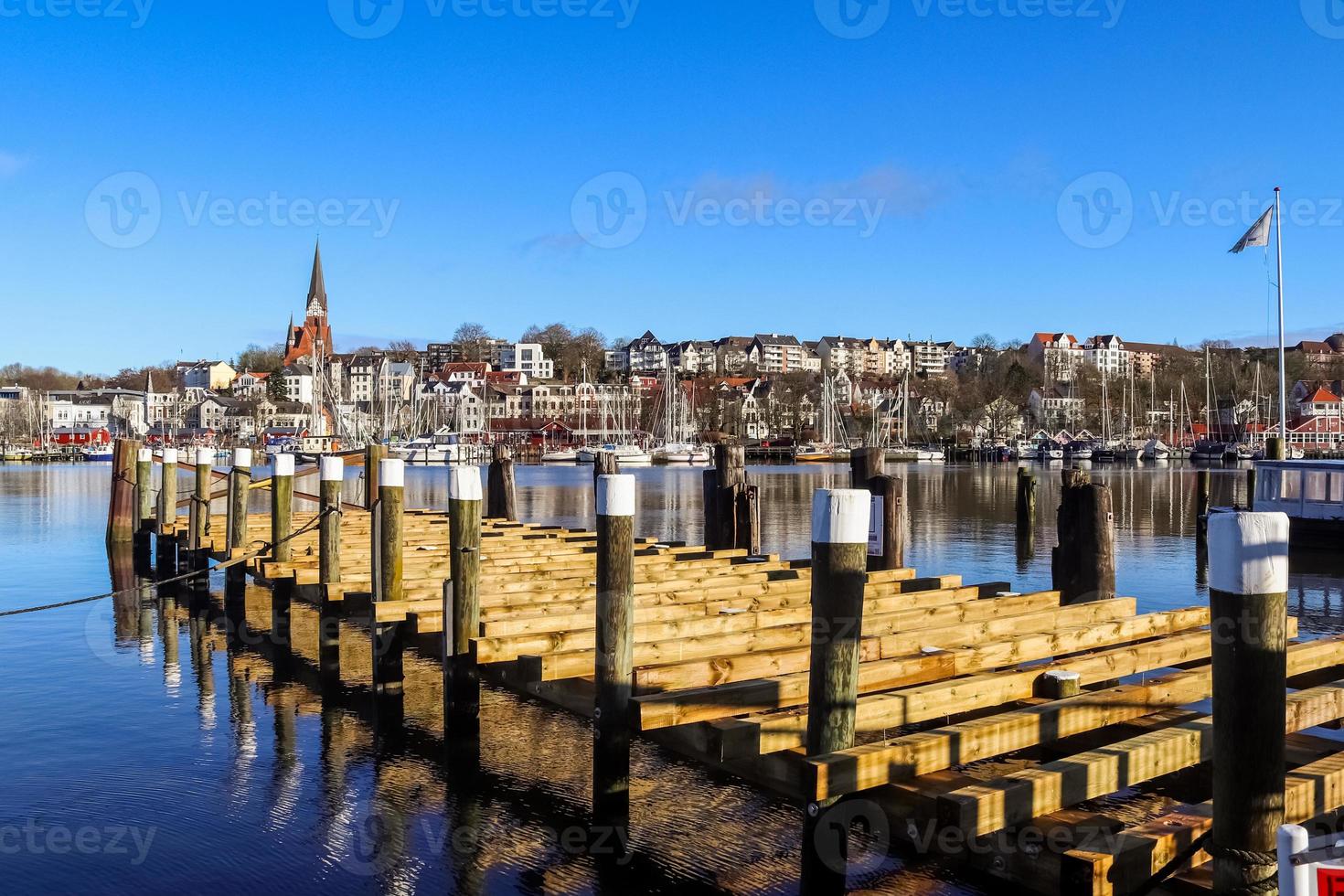 View of the historic harbour of Flensburg in Germany with some ships. photo