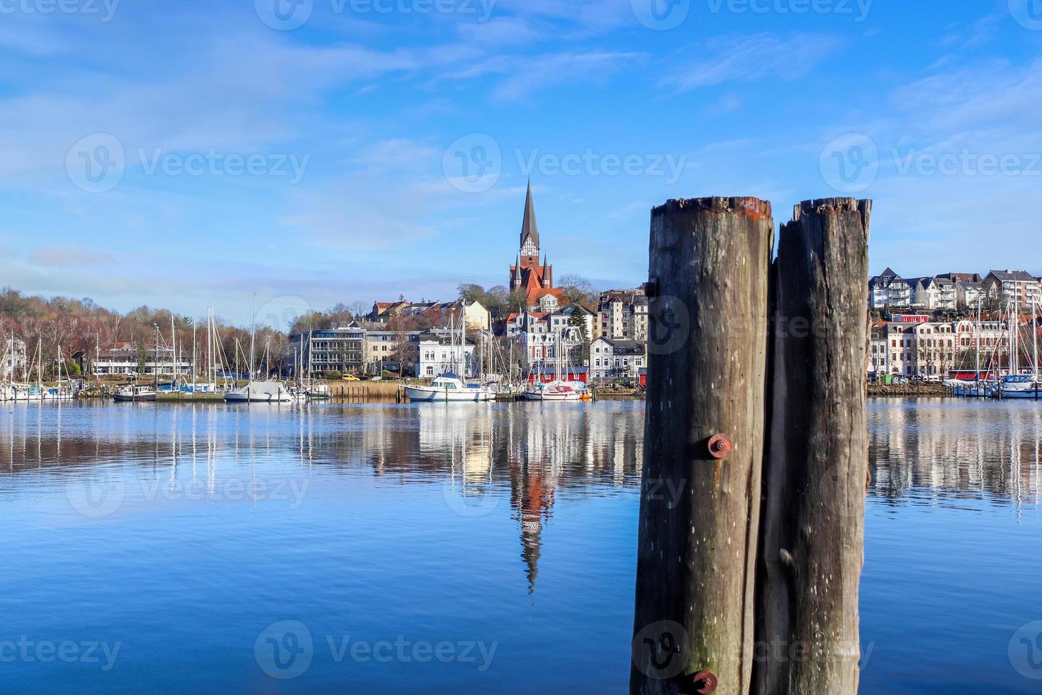 View of the historic harbour of Flensburg in Germany with some ships. photo