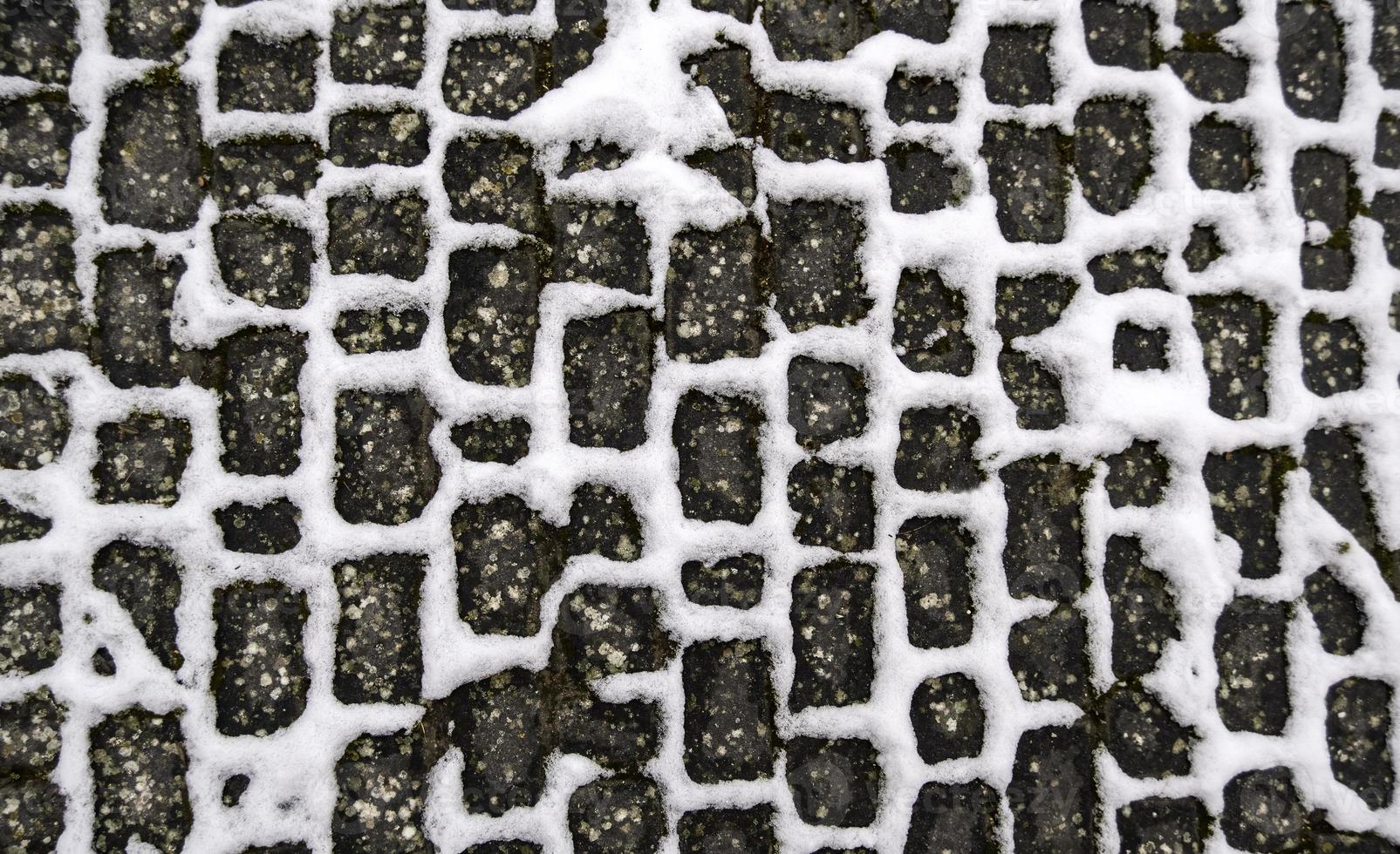 Snowy cobblestone floor photo