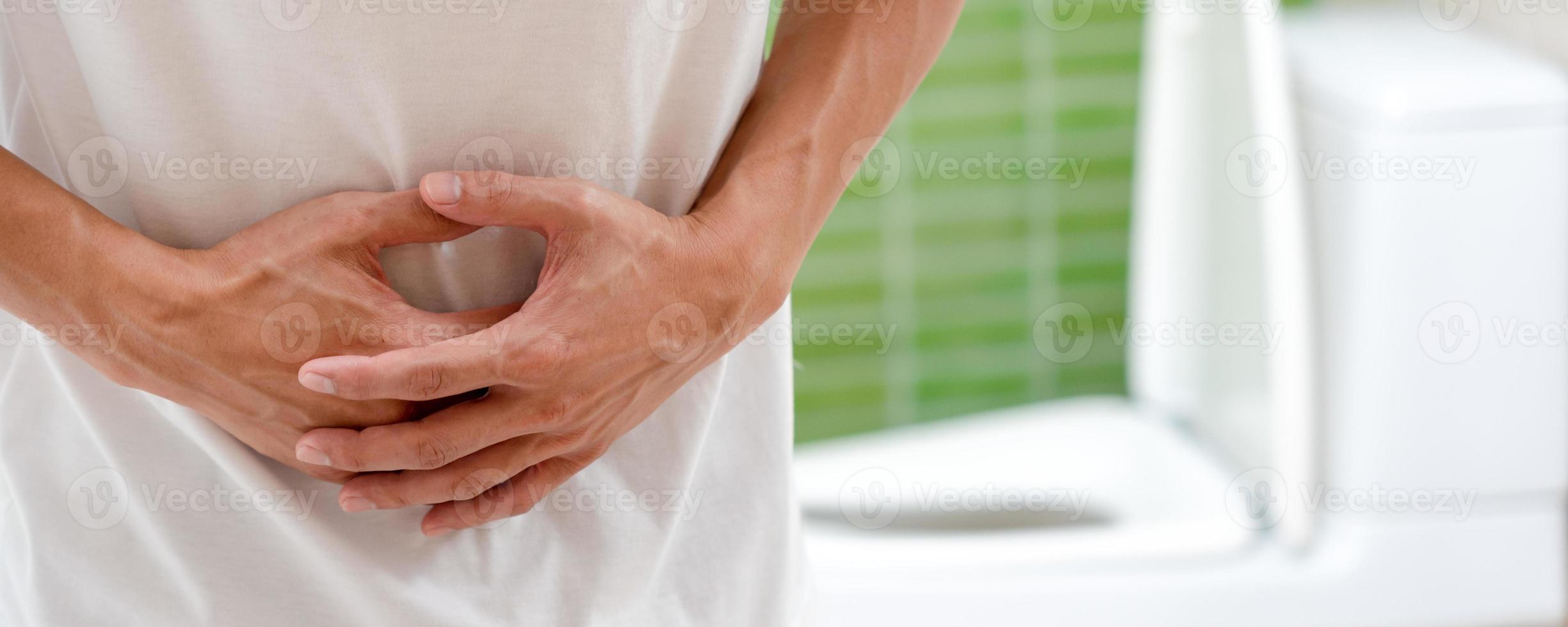 stomach ache. Asian men have abdominal pain, indigestion, gastritis, menstrual cramps, flatulence, diarrhea, distention, colon cancer, belly inflammation problem, suffer food poisoning, abdomen photo