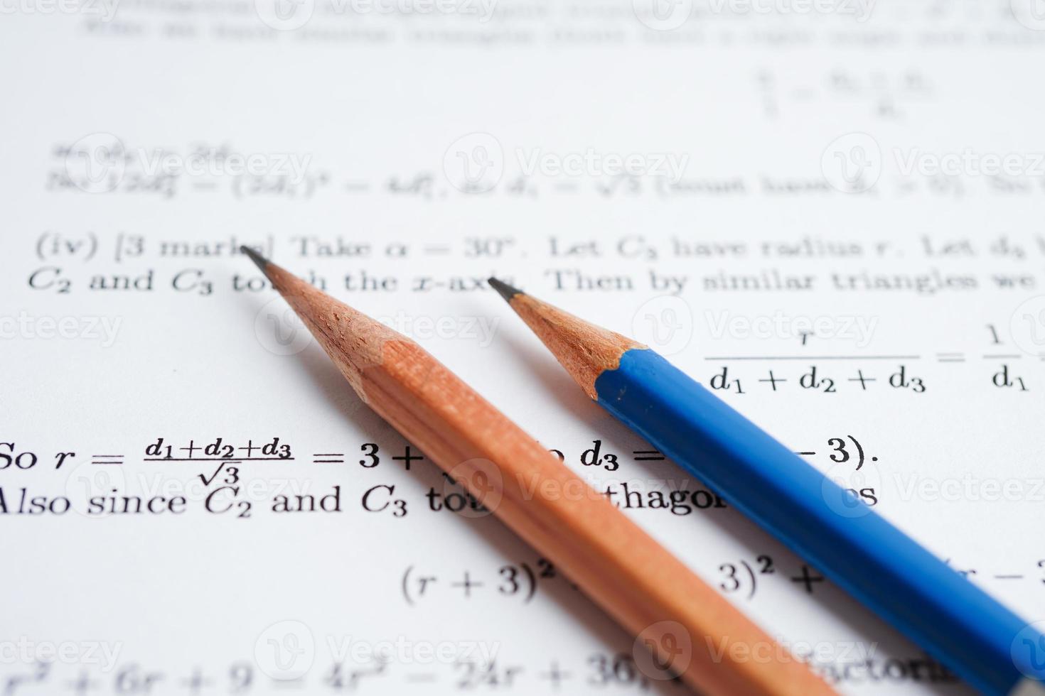 Pencil on mathematic formula exercise test paper in education school. photo
