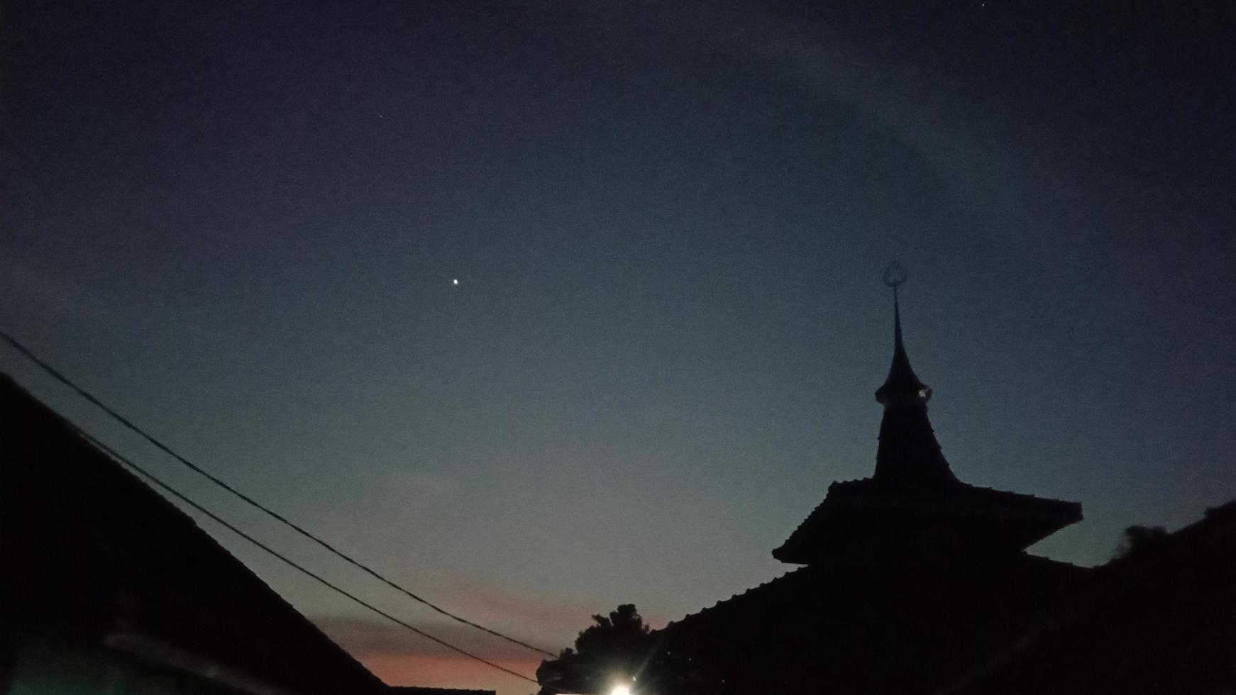 a mosque and the sky in the evening photo