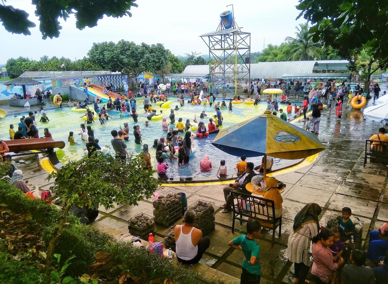 The atmosphere of swimming pool tours on holidays. many visitors especially local residents. photo