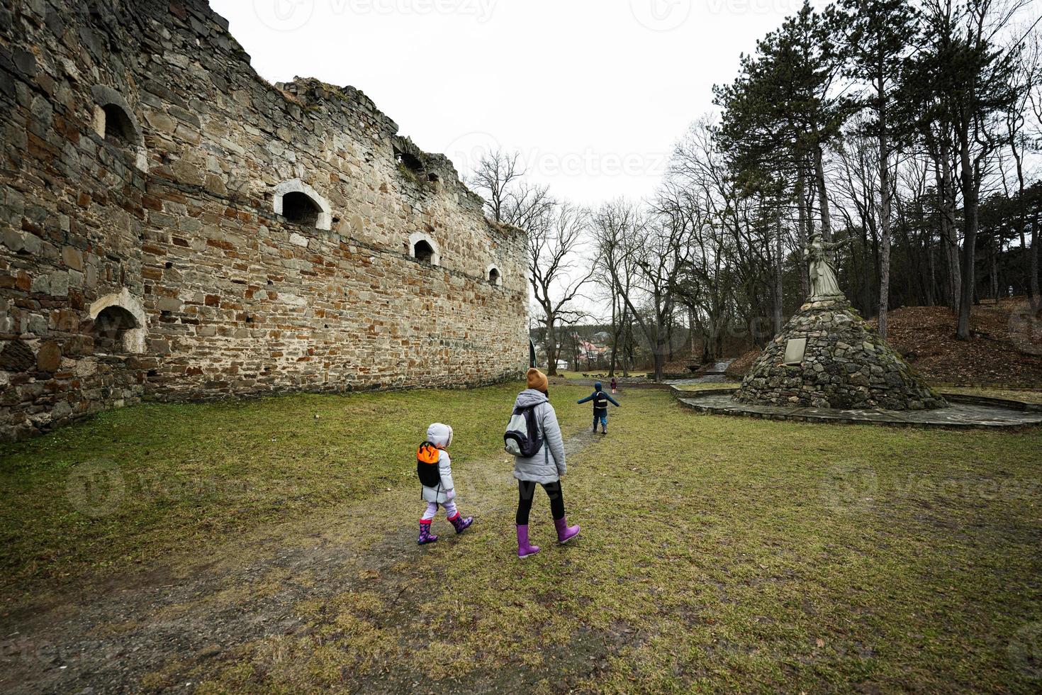 Mother and girls visit ancient medieval fortress Terebovlia castle, Ukraine. photo